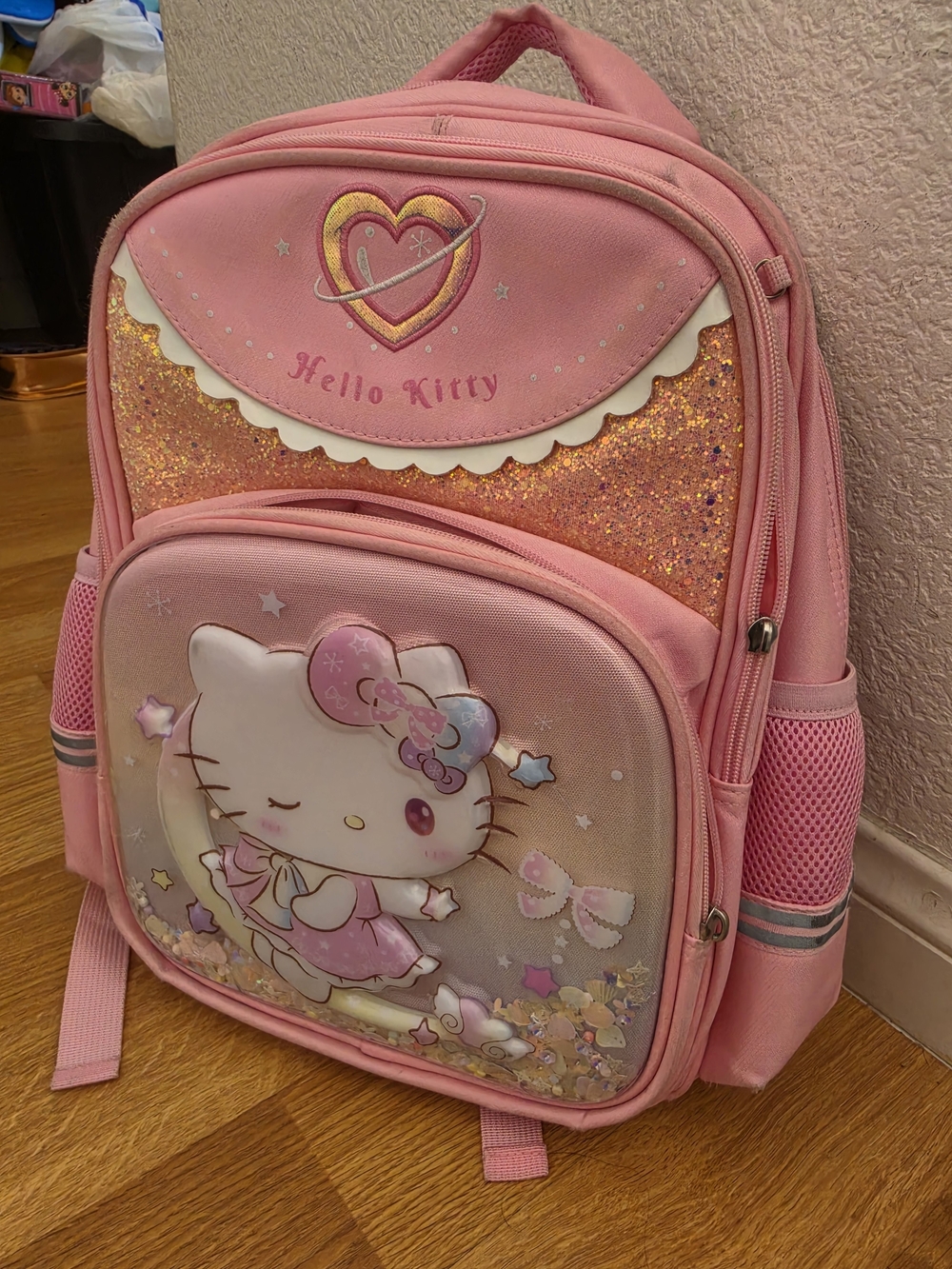 pink Sanrio Hello Kitty school backpack featuring an adorable 3D molded characte